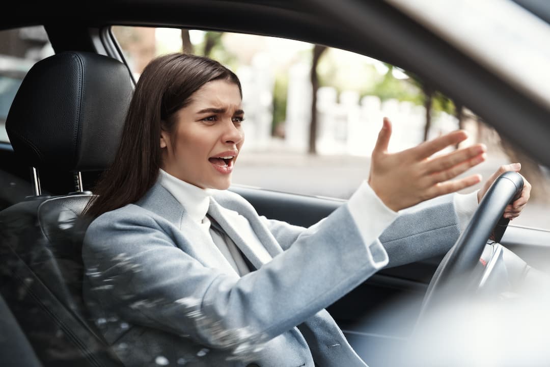 annoyed-businesswoman-stuck-traffic-her-commute (1) annoyed-businesswoman-stuck-traffic-her-commute (1)