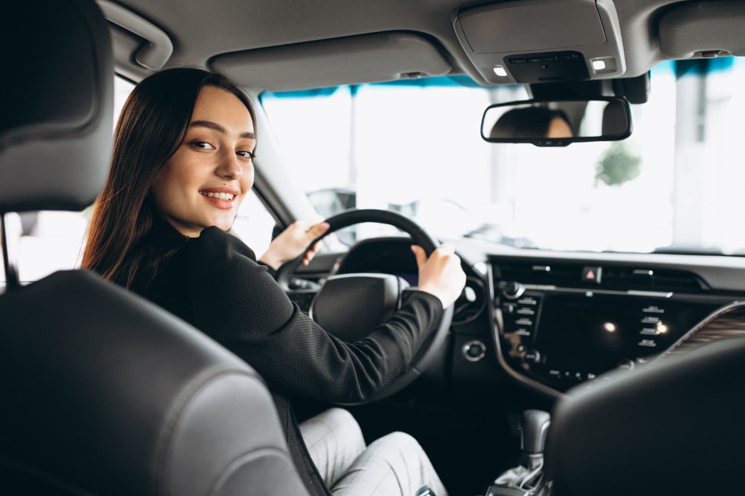 young-woman-testing-car-car-showroom (1) young-woman-testing-car-car-showroom (1)